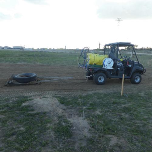 UTV pulling weighted down modified harrow to prepare seedbed for native planting Credit: Ryan Lawler